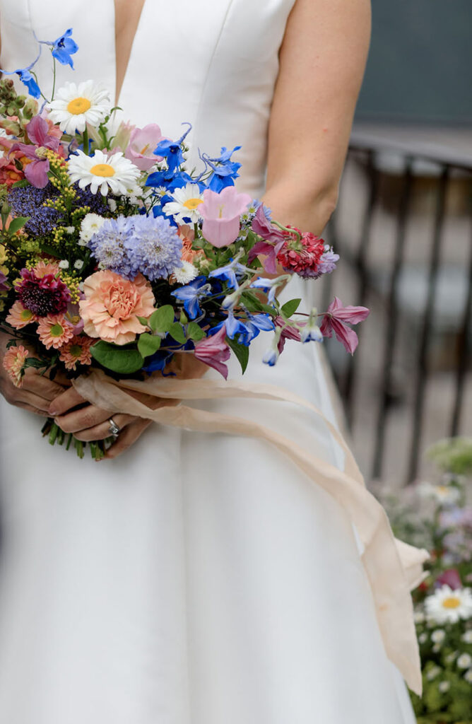 Dolomites Wedding at Kolfuschgerhof with wild flowers