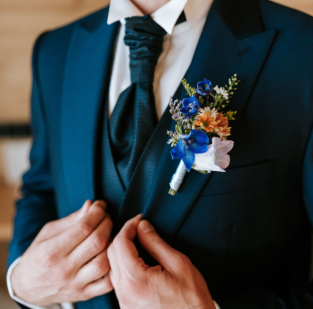 Wedding in the Dolomites with wildflowers - getting ready at Kolfuschgerhof